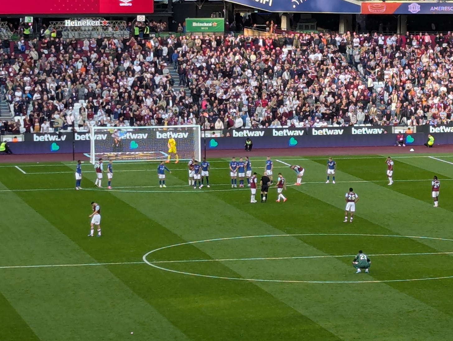 West Ham line-up a direct free kick from 25 yards out. Ipswich line-up their wall. West Ham goalkeeper squats in the foreground. 