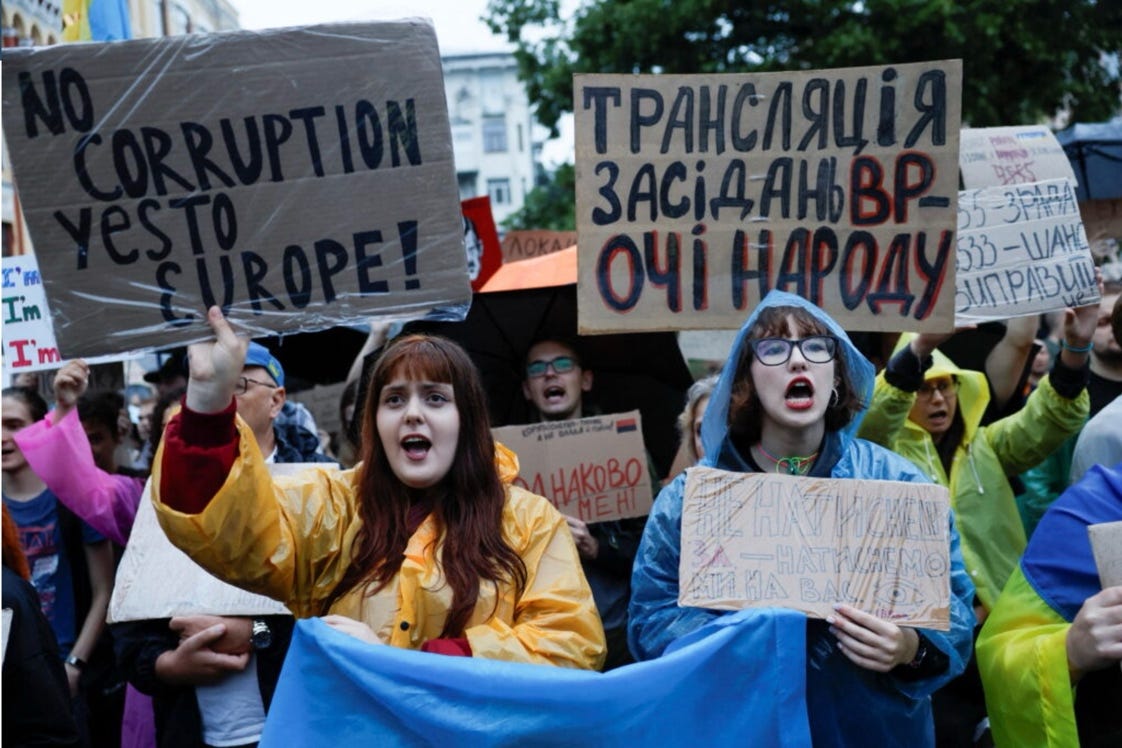 A group of people protesting

AI-generated content may be incorrect.