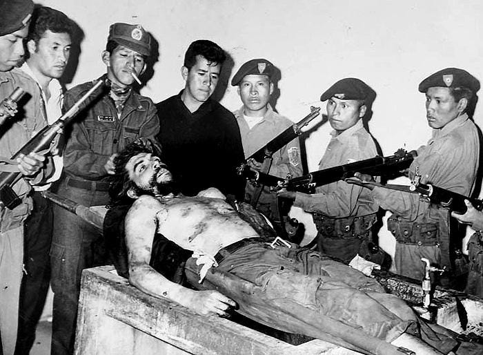 The grim display of Che Guevara's corpse to the news media in Vallegrande, Bolivia, 1967, a day after his execution, marking the end of a revolutionary era.