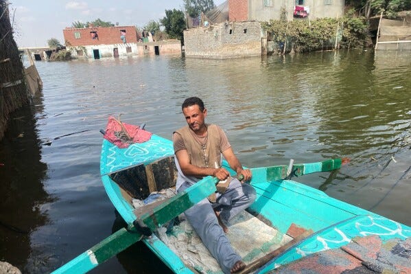 A farmer rows his boat after flooding in Dalhamo Village, near the Delta city of Ashmoun, Egypt, Friday, Oct. 3, 2025. (Gehad Gad, Egypt Telegraph via AP) A farmer rows his boat after flooding in Dalhamo Village, near the Delta city of Ashmoun, Egypt, Friday, Oct. 3, 2025. (Gehad Gad, Egypt Telegraph via AP)