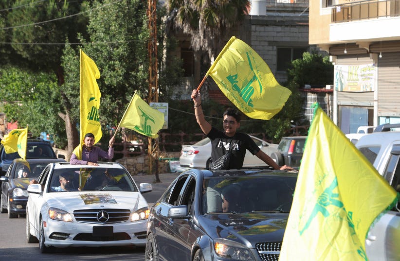 Supporters of Lebanon's Hezbollah leader Sayyed Hassan Nasrallah, carry flags as they ride in a convoy, marking the commemoration of Israel's withdrawal from southern Lebanon in 2000, in Houla village, near the border with Israel, southern Lebanon, May 25, 2023 (photo credit: REUTERS/AZIZ TAHER) Supporters of Lebanon's Hezbollah leader Sayyed Hassan Nasrallah, carry flags as they ride in a convoy, marking the commemoration of Israel's withdrawal from southern Lebanon in 2000, in Houla village, near the border with Israel, southern Lebanon, May 25, 2023 (photo credit: REUTERS/AZIZ TAHER)