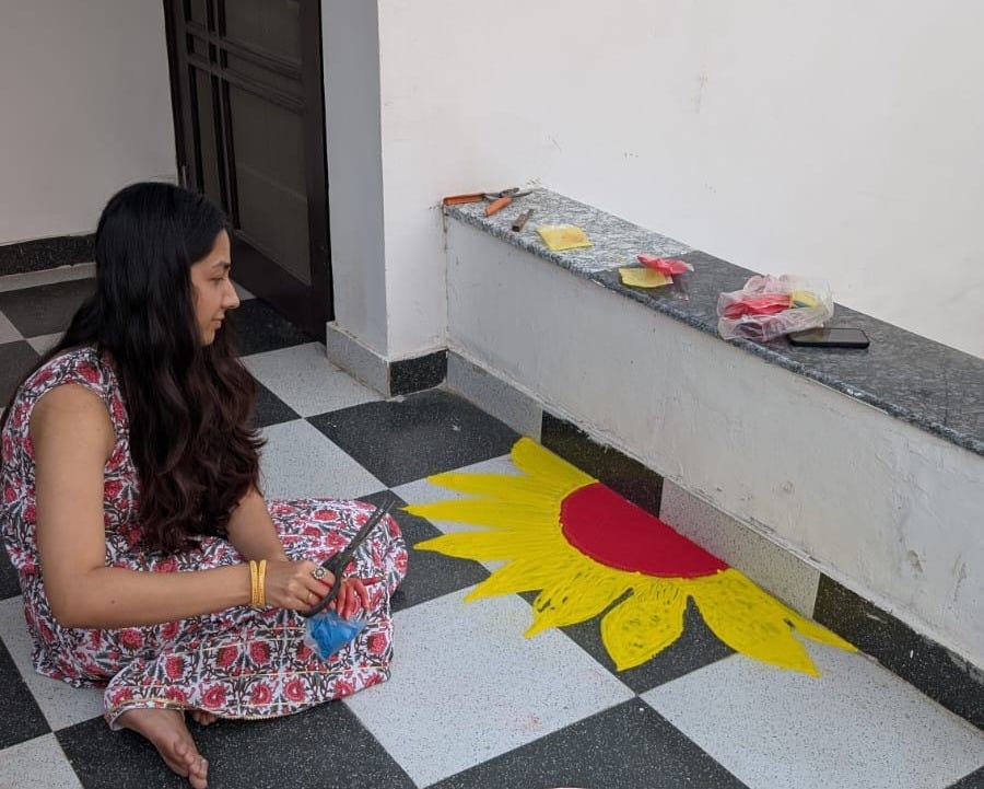 making rangoli on diwali