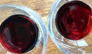 Porto Kopke Fine Ruby (left) shows a darker, purpler color than the bronze-red Porto Kopke Fine Tawny at right.