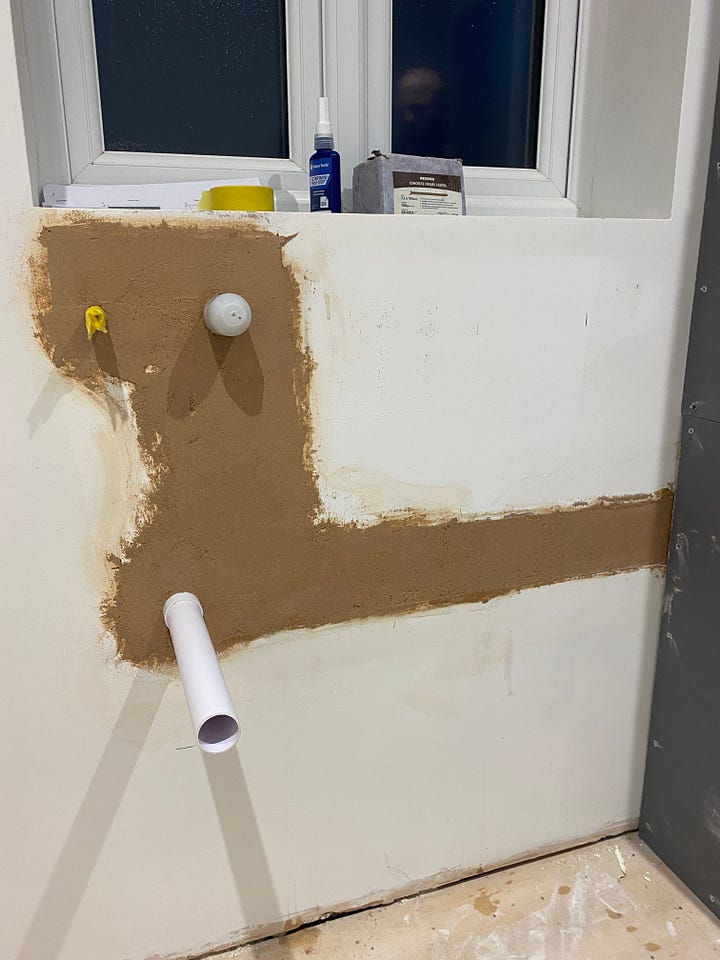 The holes in the wall have been filled out with plasterboard and bonding