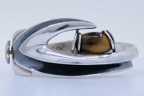 https://www.rubylane.com/item/2013583-ABG192/Taxco-Sterling-Floral-Motif-Link-Bracelet