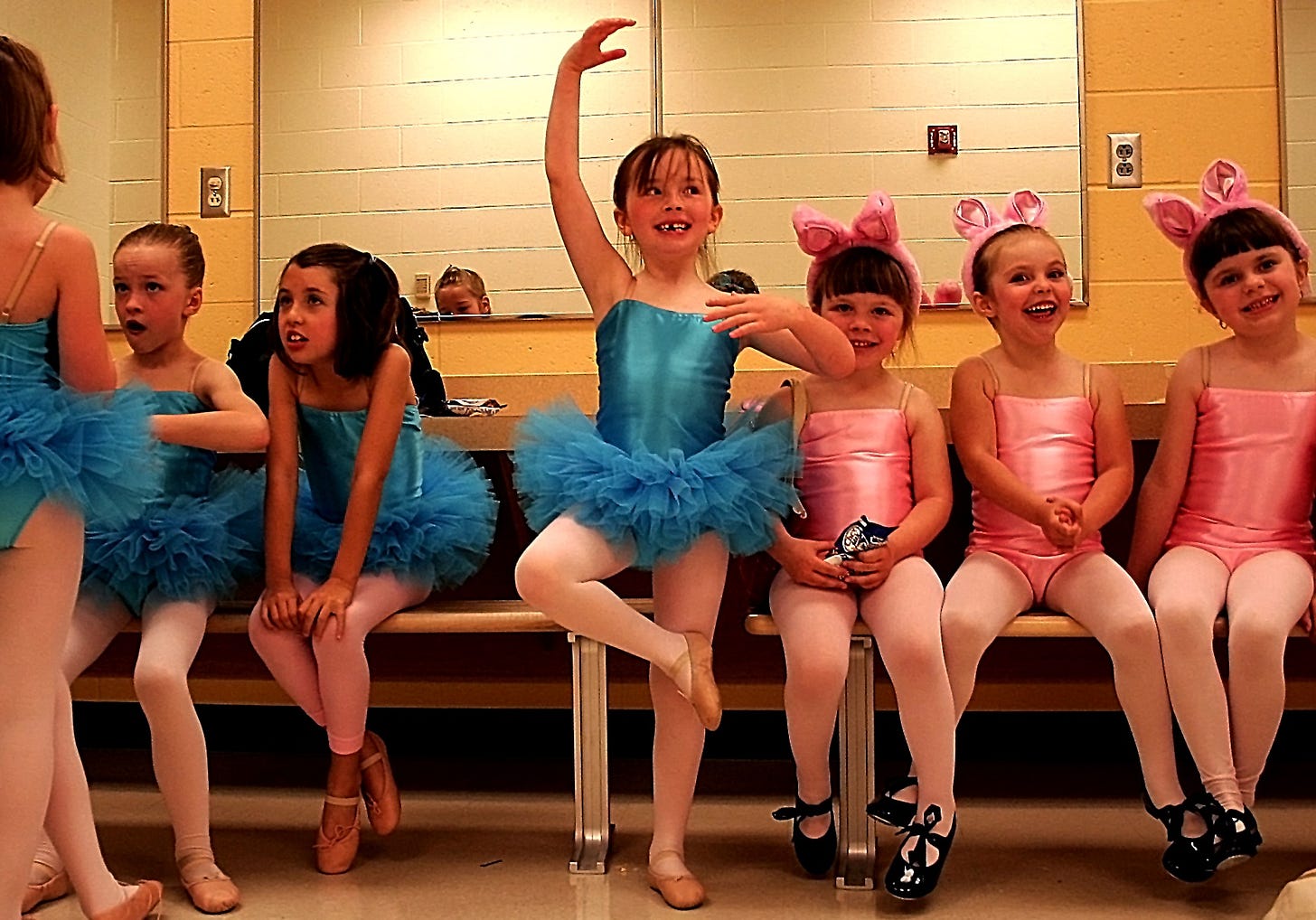 Nervous energy takes many forms in excited kids. Some chat. Some go to the bathroom. Some tug at their costumes. Others stand up and show off their skills before show time. Needless to say, when little kids gear up for big events, there will always be lots of delightful smiles in store for everyone.