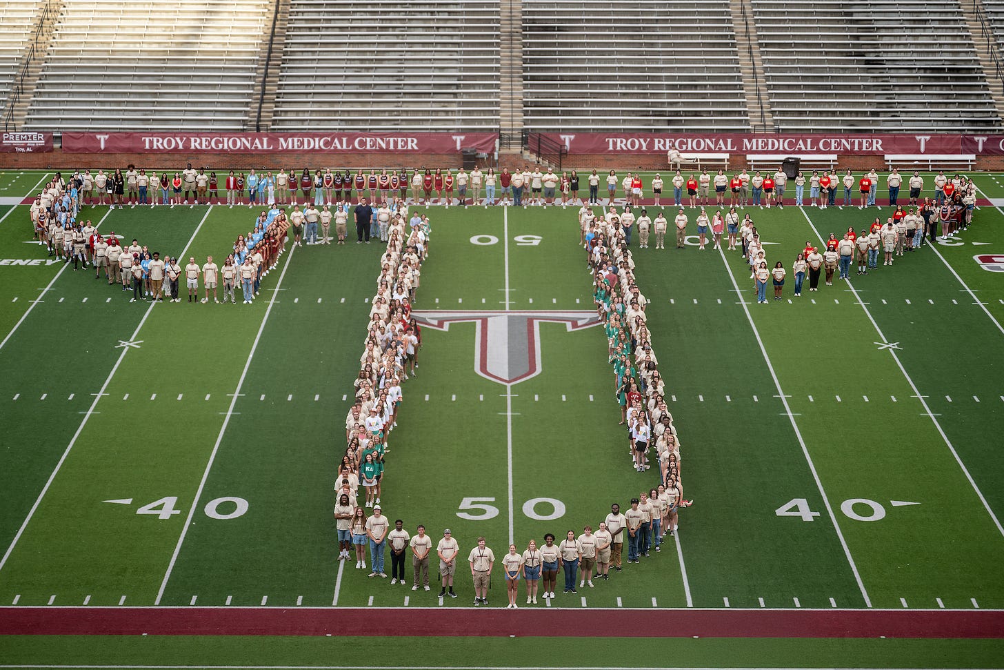 Students form a Power T on the football field after the annual Odyssey Convocation on Tuesday night.  