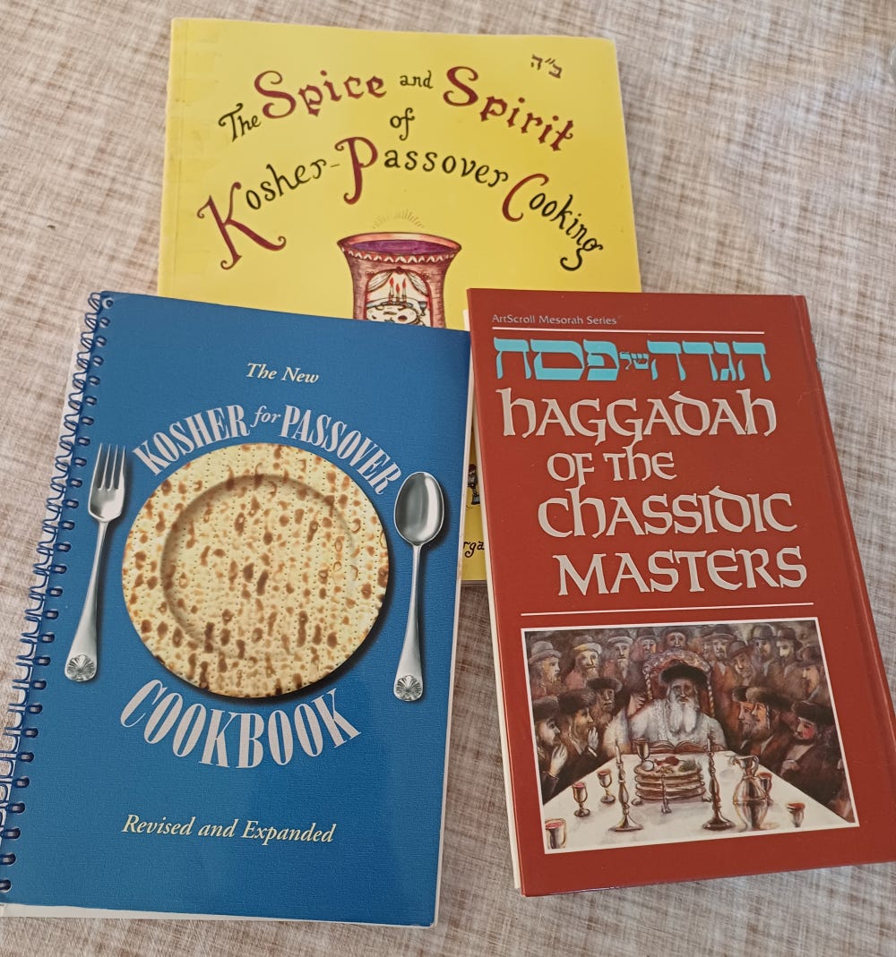 Photo of two cookbooks and a haggadah