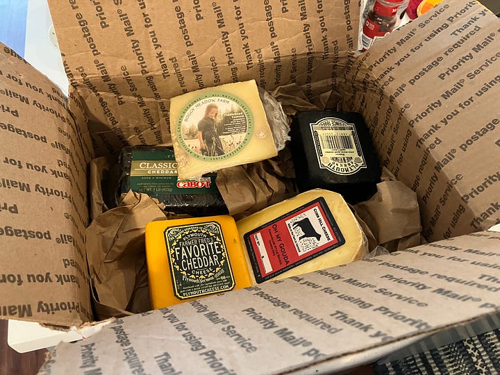 Box filled with different cheese from Vermont