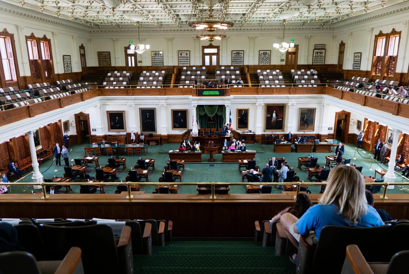 A picture containing indoor, scene, furniture, government

Description automatically generated