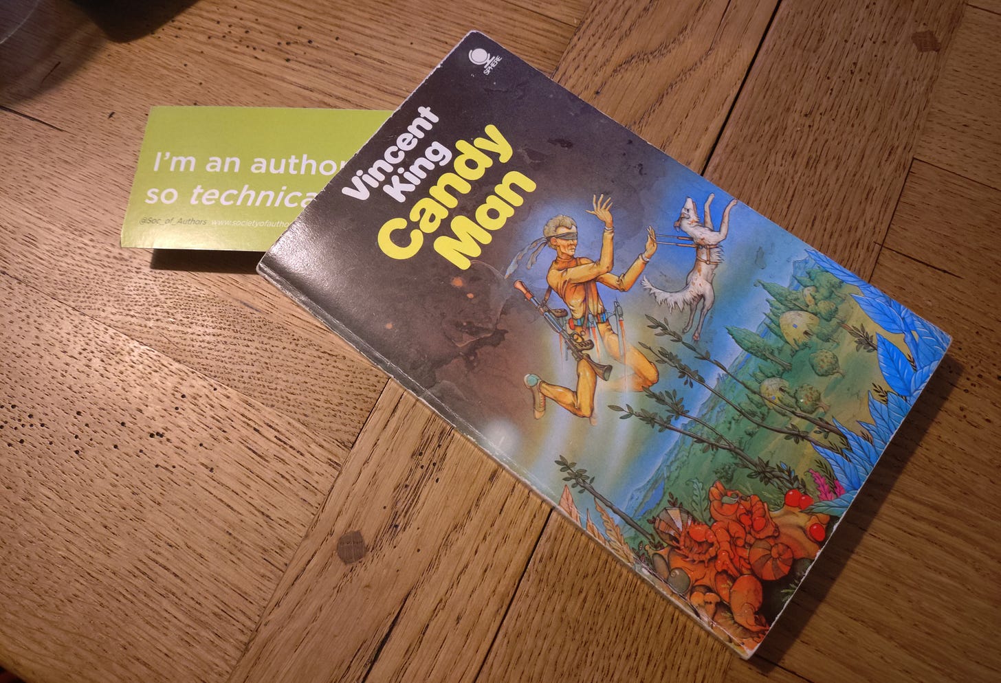A paperback copy of Candy Man by Vincent King with a bookmark sticking out of it. A paperback copy of Candy Man by Vincent King with a bookmark sticking out of it.
