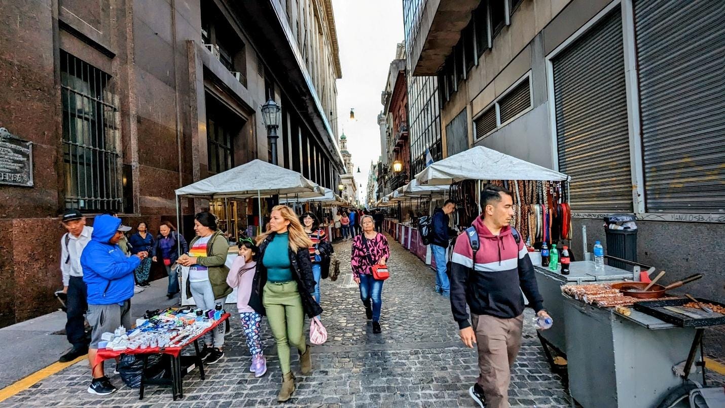A group of people walking down a street
Description automatically generated A group of people walking down a street
Description automatically generated