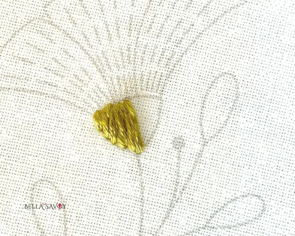 satin stitch filling in left half of flower receptacle template