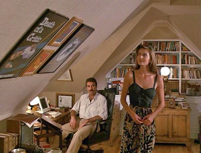 This may contain: a man and woman in an attic office This may contain: a man and woman in an attic office