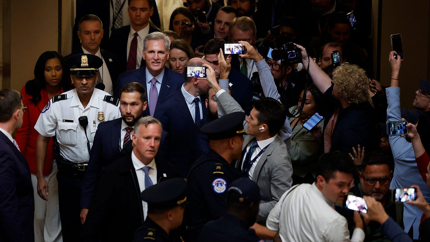 Former Speaker of the House Kevin McCarthy is surrounded by staff, security and journalists as he walks through Statuary Hall after he was ousted at the Capitol on October 3, in Washington, DC. Former Speaker of the House Kevin McCarthy is surrounded by staff, security and journalists as he walks through Statuary Hall after he was ousted at the Capitol on October 3, in Washington, DC.