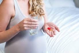 Premium Photo | Pregnant woman taking a ...
