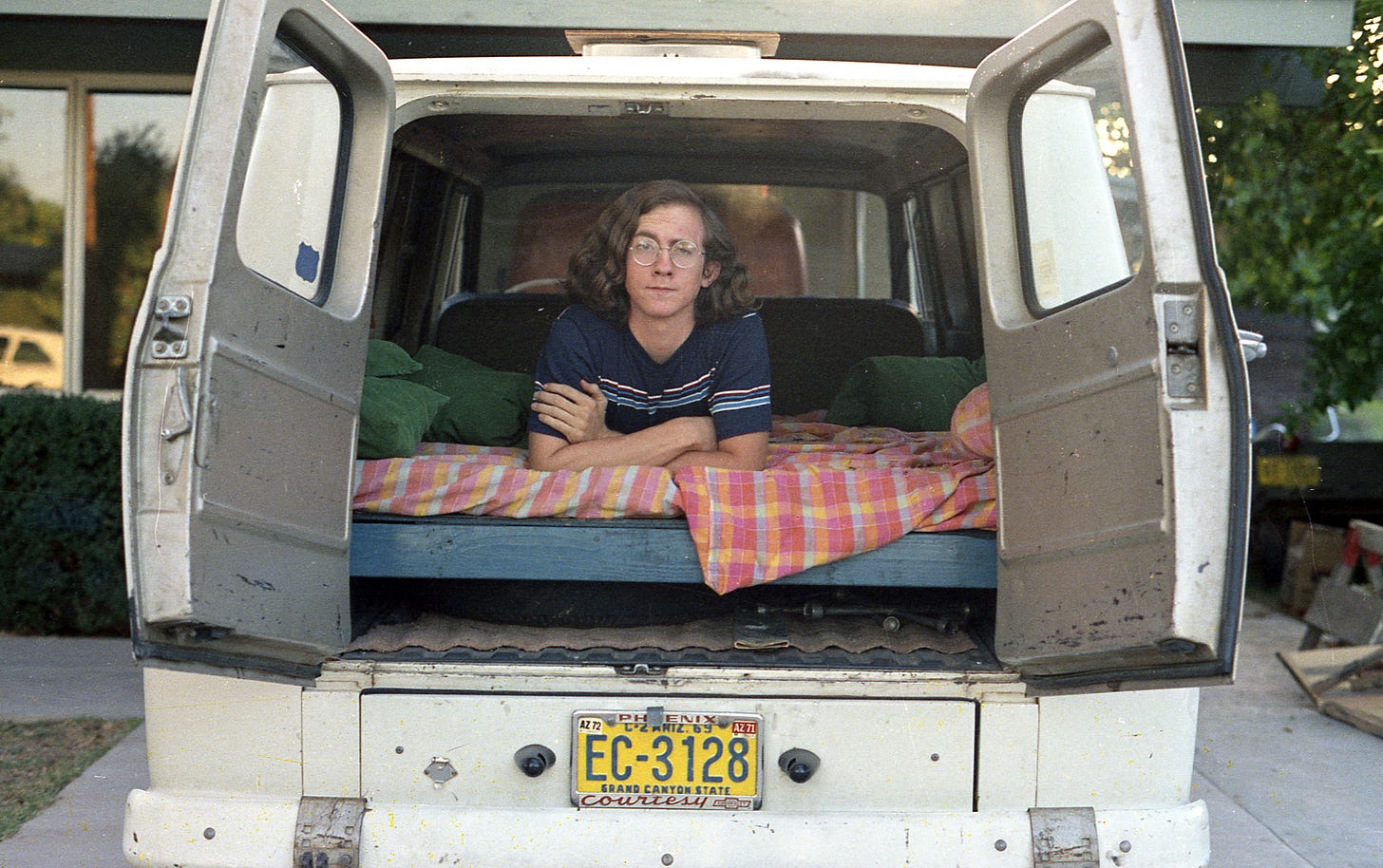 man in back of van