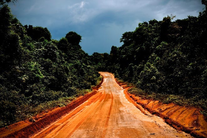 The main road through Guyana, above, sometimes impassable, is the only link 
between Brazil and the port city of Georgetown, below. Investors want to 
pave the route as a trade highway from the interior.NEW YORK TIMES / 
MERIDITH KOHUT