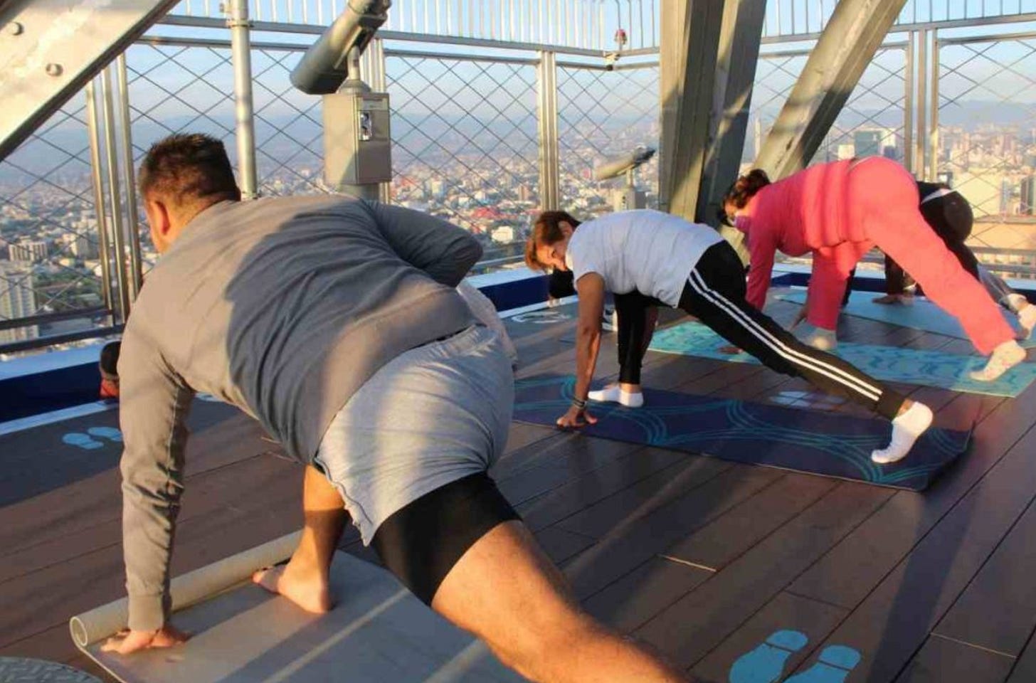 Doing yoga 44 floors up while the sun rises