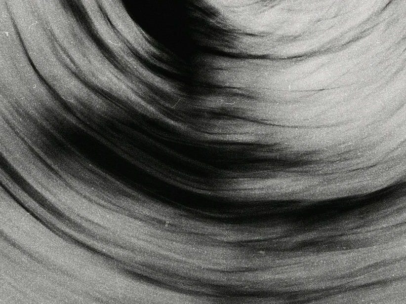 a black and white photo of a circular object a black and white photo of a circular object