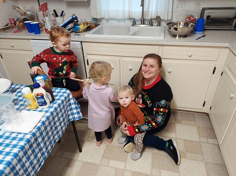 A women working, people at a restaurant, a woman looking after three children