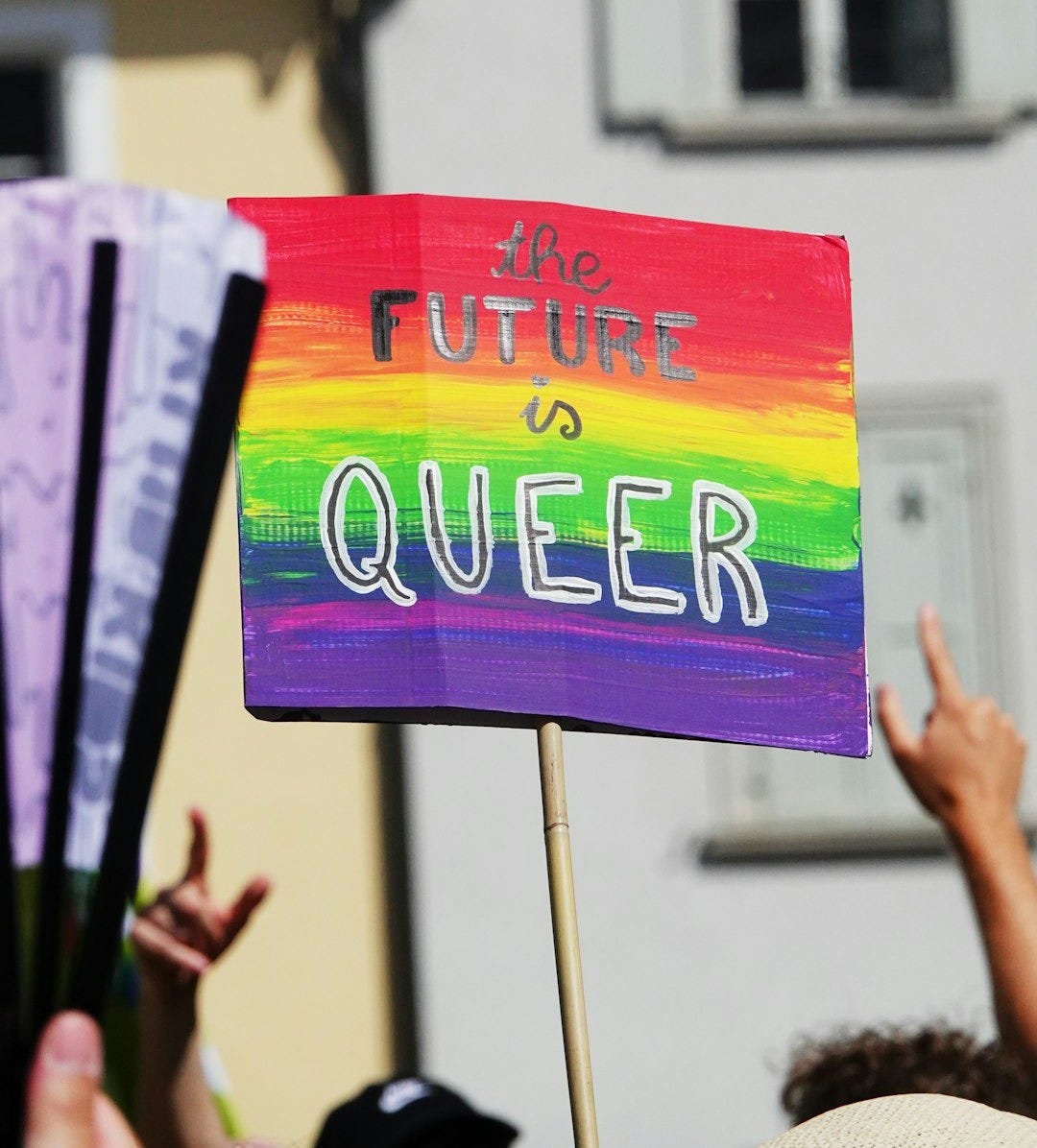a group of people holding up a sign