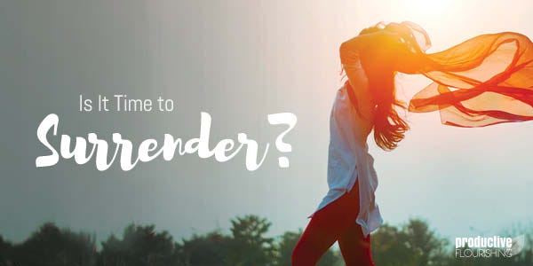 A woman standing against the sunlight with a scarf. Text Overlay: Is It Time To Surrender? A woman standing against the sunlight with a scarf. Text Overlay: Is It Time To Surrender?