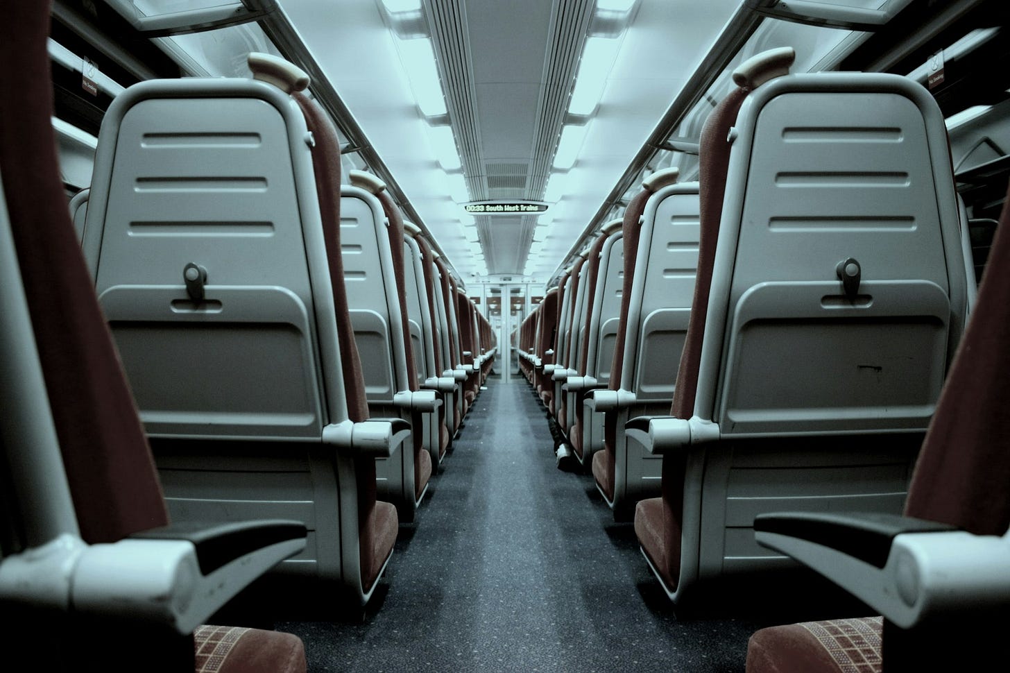 Seats on the inside of a train Seats on the inside of a train