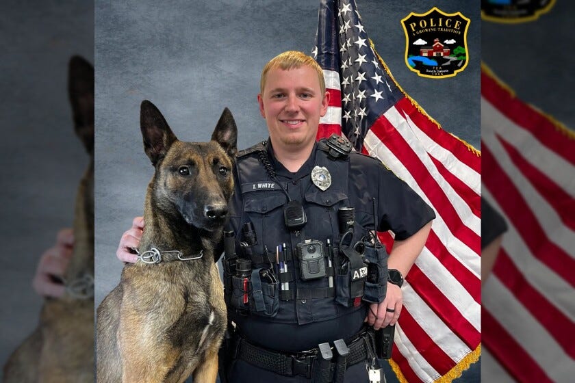 Suni and Officer White Tea Police.jpg Suni and Officer White Tea Police.jpg