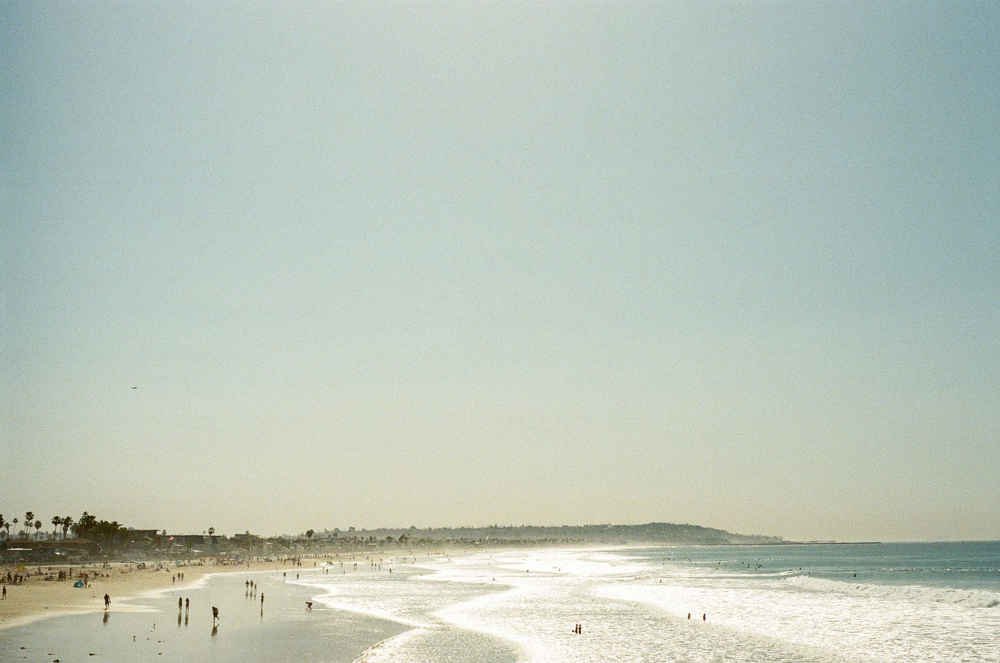 Pacific Beach in San Diego on a sunny day where the beach is busy