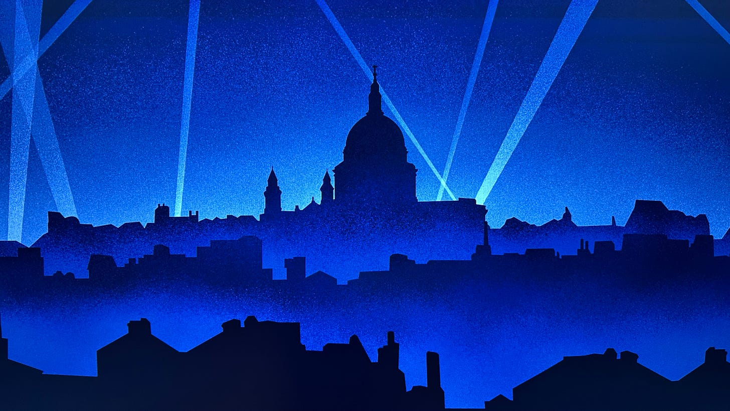 Silhouette of St. Paul’s Cathedral dome above the London rooftops at night, crossed by searchlight beams. Wall mural in the Churchill War Rooms.