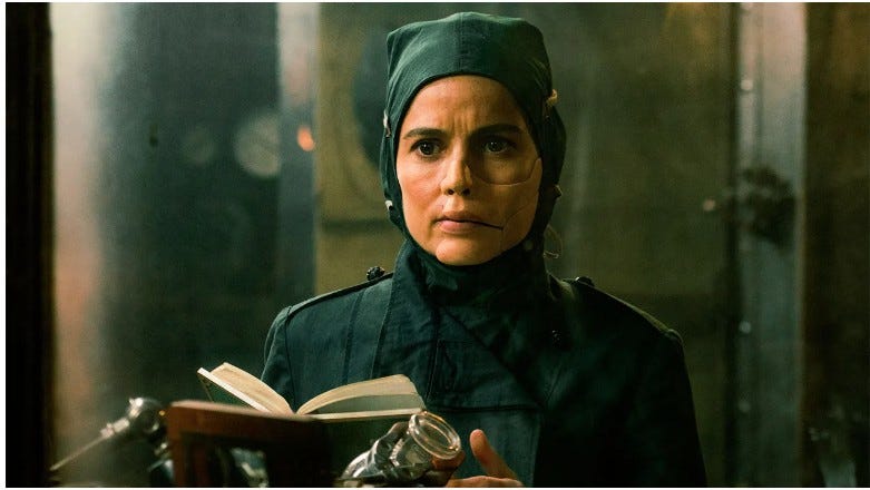 Elena Anaya portrays Doctor Poison in the 2017 Wonder Woman film. Wearing a dark military coat and a ceramic facial mask that conceals injuries, the scientist stands in a World War I laboratory. The character specializes in developing poison gas weapons and serves as a fictional counterpart to themes explored in the life of chemist Fritz Haber, pioneer of the Haber-Bosch process and chemical warfare during World War I. Elena Anaya portrays Doctor Poison in the 2017 Wonder Woman film. Wearing a dark military coat and a ceramic facial mask that conceals injuries, the scientist stands in a World War I laboratory. The character specializes in developing poison gas weapons and serves as a fictional counterpart to themes explored in the life of chemist Fritz Haber, pioneer of the Haber-Bosch process and chemical warfare during World War I.