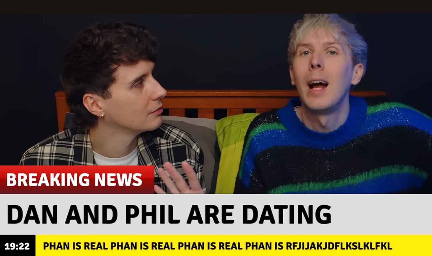 a screenshot of Dan and Phil's video where they are parodying news outlets saying "breaking news dan and phil are dating"