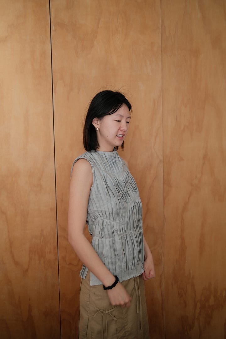 First image is me standing in front of some closet doors, second image is me at the postal office museum