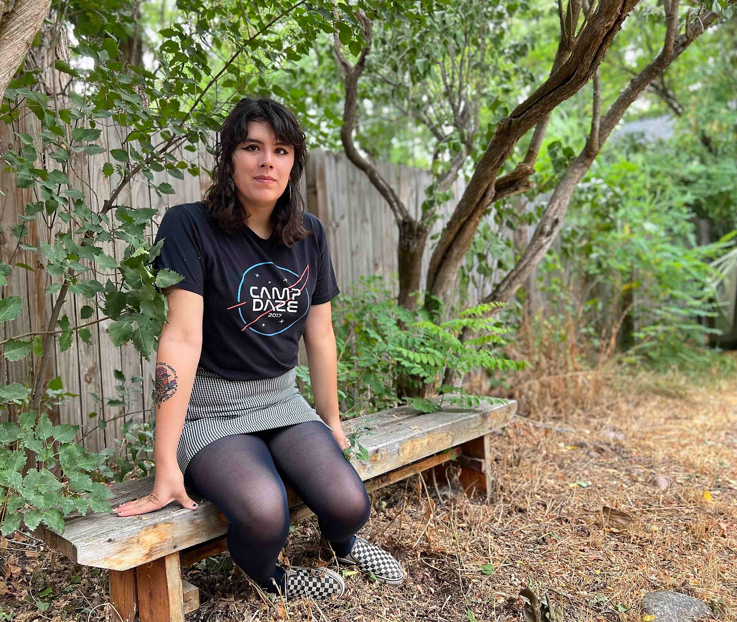 woman in black shirt on outdoor bench