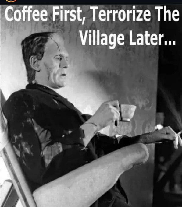 Black-and-white photograph-style image of Frankenstein's monster seated in a wooden chair, wearing a dark suit and white shirt, with neck bolts visible on his neck, holding a small teacup in his right hand raised to his mouth, and a lit cigarette in his left hand, looking directly at the viewer with a neutral expression, set against a plain background.