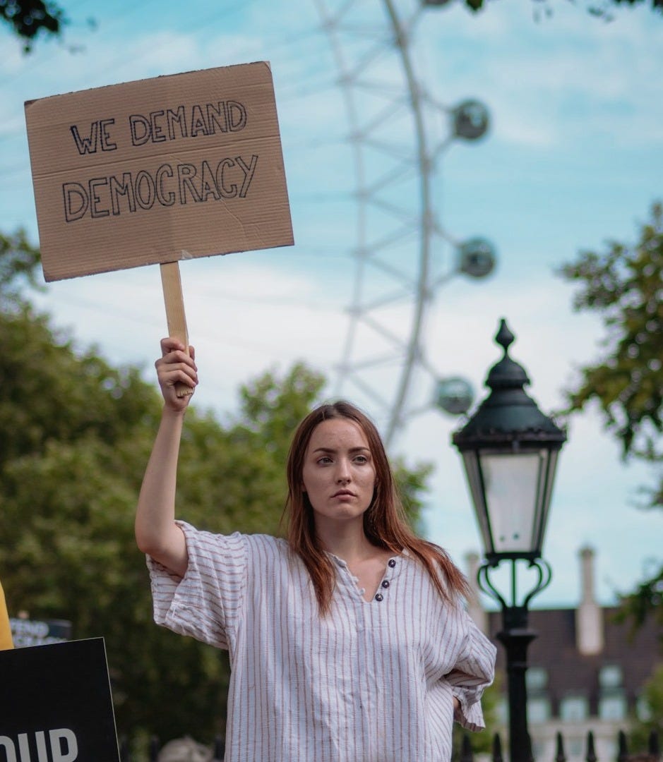 woman holding signboard