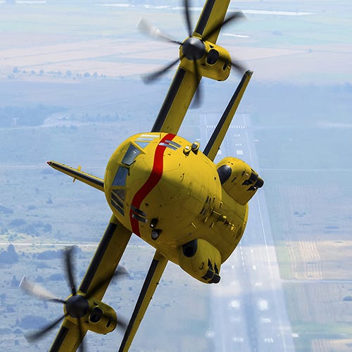 A yellow airplane flying over a road

AI-generated content may be incorrect.