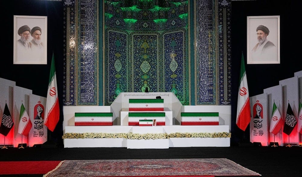 The coffins of martyred Iranian Leader Sayyed Ali Khamenei, center on top, and members of his family are displayed ahead of the dayslong funeral ceremonies at the Imam Khomeini Mosalla Grand Mosque in Tehran, Iran, Friday, July 3, 2026. (AP)
