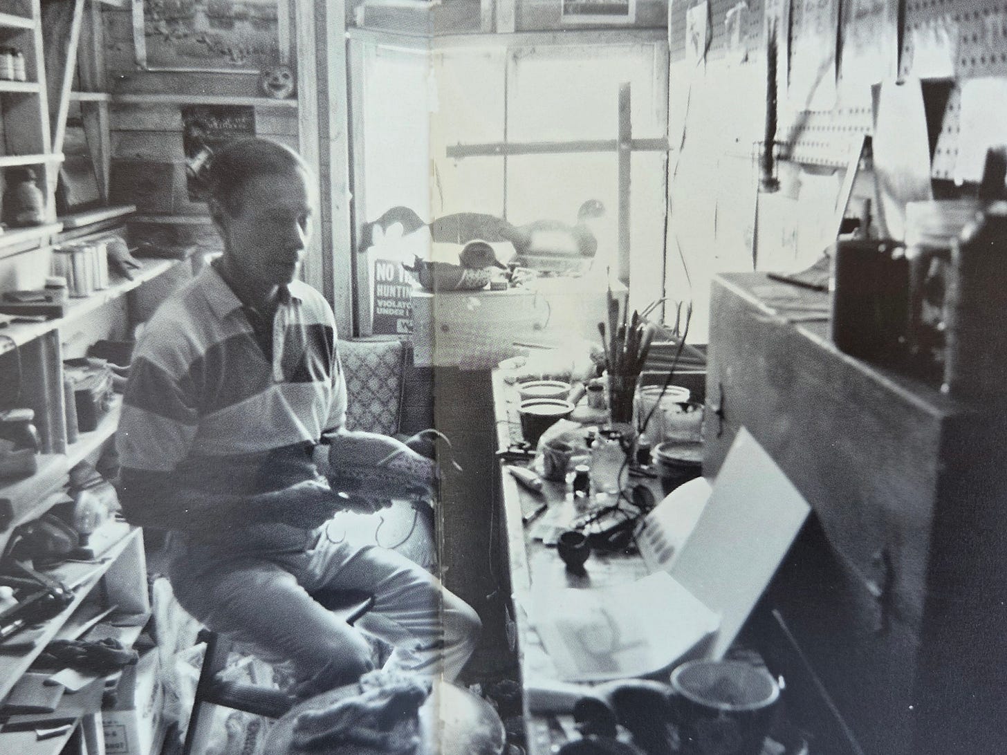 Ron Vavra holding a decoy in his workshop