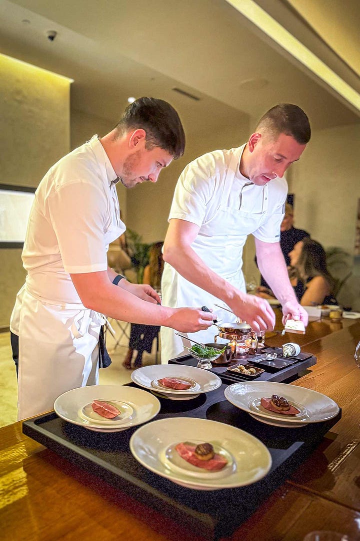 Torsten Vildgaard is the second chef on the right plating the duck in the first photo. The second photo features other FZN chefs plating the tart tatin.
