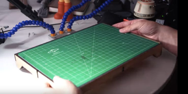 A CNC-cut riser for a cutting mat.