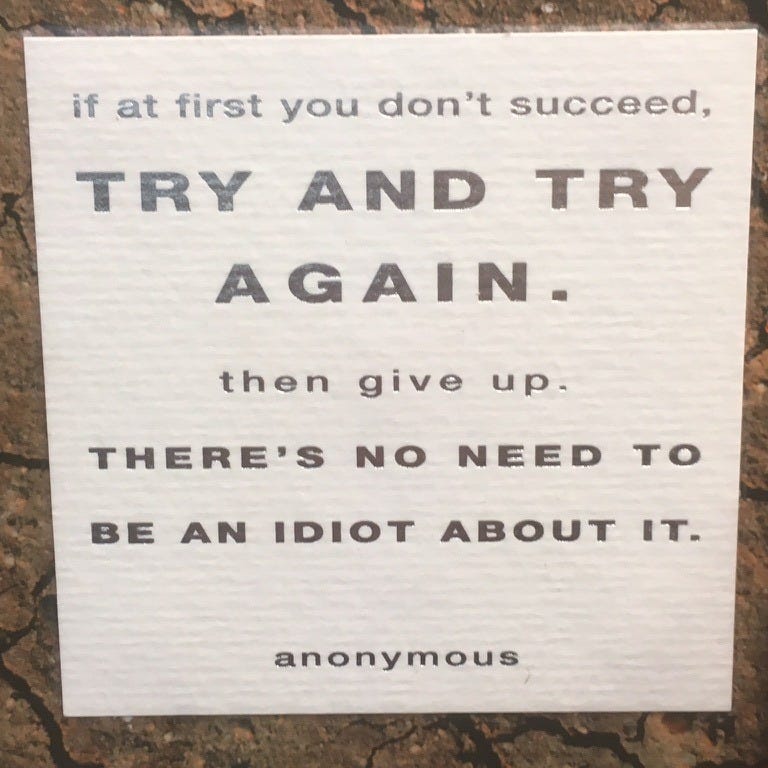 sign that reads "if at first you don't succeed, try and try again. Then give up. There's no need to be an idiot about it."
