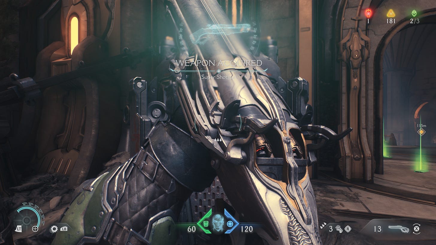 Doomguy observes his new super shotgun in first person view. On screen, an alert reads "Weapon acquired - super shotgun."