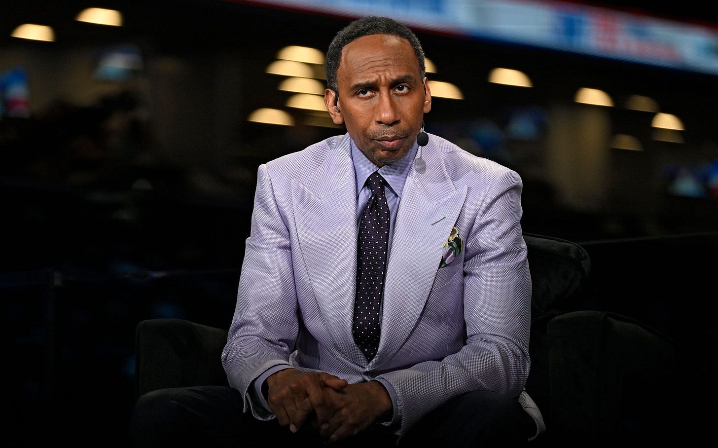 Stephen A. Smith in a suit looks ahead. Stephen A. Smith in a suit looks ahead.