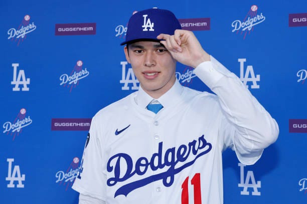 Pitcher Roki Sasaki poses during a Los Angeles Dodgers press conference at Dodger Stadium on January 22, 2025 in Los Angeles, California.