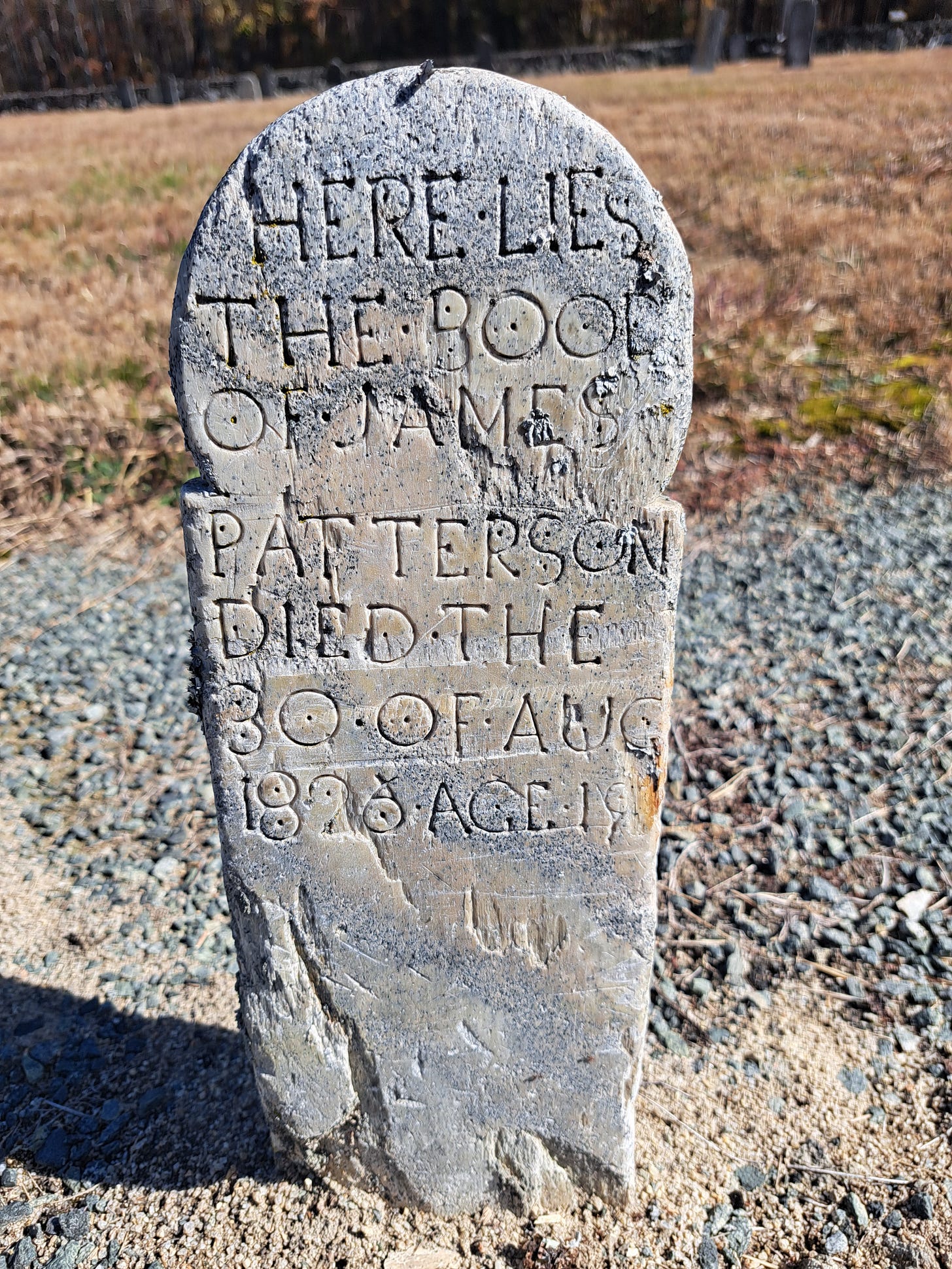 Old tombstone reading "Here lies the boody of James Patterson, died the 30th of Aug 1826 Age 18." Old tombstone reading "Here lies the boody of James Patterson, died the 30th of Aug 1826 Age 18."