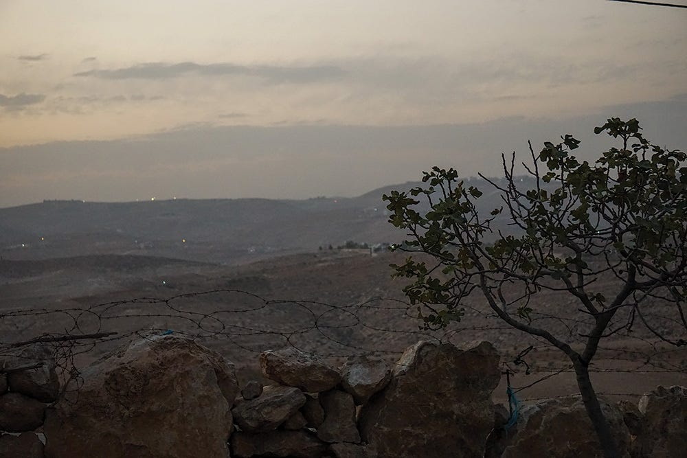 The hamlet of Fatah Sidru and, beyond that, the city of Yatta are visible from the western edge of Az Zuweidin. (E. A. Halevi / Jacobin) The hamlet of Fatah Sidru and, beyond that, the city of Yatta are visible from the western edge of Az Zuweidin. (E. A. Halevi / Jacobin)