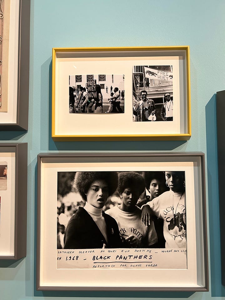 Viola Davis on a screen, costumes on mannequins, Marlee Matlin accepting her Oscar, an Oscar in a case, and photos of the Black Panthers from a documentary.
