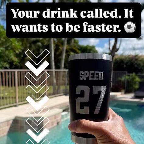 College soccer player in a white Saint Mary’s jersey with number 27 sprints across a sunny field near the goal, with a teammate and the net softly blurred in the background.